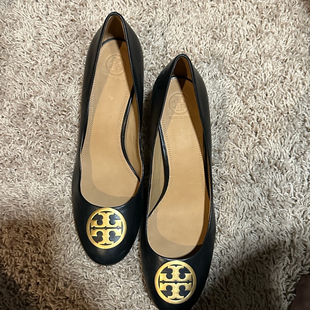 Black block heel pumps by Tory Burch